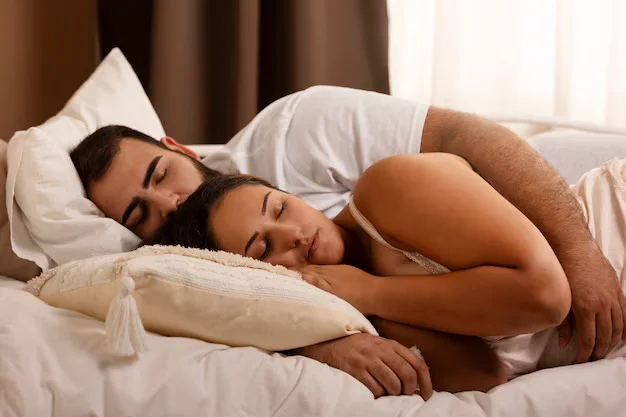 high-angle-romantic-couple-bed-23-2149903760